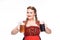 smiling oktoberfest waitress in traditional bavarian dress showing mugs with light and dark beer