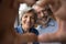 Smiling old age couple unite fingers before camera in heart