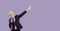 Smiling old businessman dance on purple background