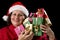 Smiling Old Woman is Holding Seven Wrapped Gifts