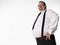 Smiling Overweight Businessman With Hand On Hip