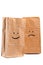 Smiling paper bag. Concept.