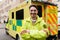 Smiling paramedic crossing arms and looking