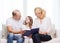 Smiling parents and little girl with at home