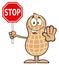 Smiling Peanut Cartoon Character Holding A Stop Sign