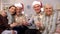 Smiling pensioners holding sparklers looking camera, Christmas celebration