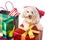Smiling poodle puppy in Santa costume with abundant Christmas gi