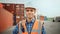 Smiling Portrait of a Handsome Caucasian Industrial Engineer in White Hard Hat, Orange High