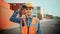 Smiling Portrait of a Handsome Caucasian Industrial Engineer in Yellow Hard Hat, Orange High