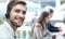 Smiling positive young businesspeople and colleagues in a call center office