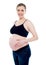 Smiling pregnant woman caressing her belly