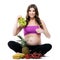 Smiling pregnant woman with fruits