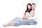 Smiling pregnant woman and her husband sitting isolated on white