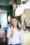 Smiling Preteen Girl Holding Vanilla Ice Cream At Parlor