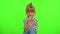 Smiling pretty little stylish blonde teen child kid girl posing isolated on chroma key background