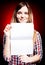 Smiling and proud young girl holding exercise book