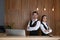 Smiling receptionists at desk in lobby