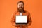 Smiling Redhaired Bearded Man Holding Laptop With Blank Screen, Studio