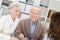 Smiling retired couple in a business meeting