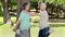 Smiling retired couple doing stretching exercises