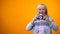 Smiling retiree woman taking photo with vintage camera, hobby and relaxation