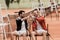 smiling retro styled tennis players giving high five