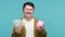 Smiling rich man showing dollar cash and piggy bank, money saving, deposit, banking