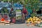 Smiling saleswoman sitting under a shade and selling watermelons on the street in Zrenjanin, Serbia