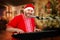 Smiling Santa singing Christmas songs