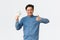 Smiling satisfied asian man in glasses and braces trying work e-commerce, freelancer got payment, showing thumbs-up and