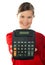 Smiling school girl showing digital calculator