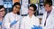 Smiling school kids doing a chemical experiment in laboratory