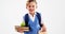 Smiling schoolboy holding books and lunch