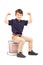 A smiling schoolboy showing his muscles seated on a pile of book