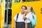 Smiling schoolgirl whispering in her friend\'s ear