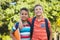 Smiling schoolkids standing in campus