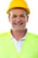 Smiling senior builder wearing hardhat