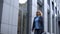 Smiling senior business lady with briefcase going to work, female politician