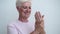 Smiling Senior Caucasian Woman Applying Hand Cream