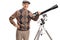 Smiling senior man with a telescope looking at the camera