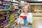 Smiling senior woman buying cereals