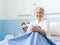 Smiling senior woman posing in a hospital bed