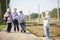 Smiling senior women take a photo on a platform waiting for  train to travel during a COVID-19 pandemic