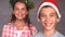 Smiling siblings with christmas hat