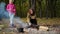 Smiling sisters on picnic in autumn forest