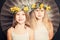 Smiling sisters, portrait with flowers