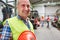 Smiling skilled worker in the warehouse of a metal factory