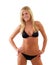 Smiling skinny young blond woman in black bikini