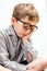 Smiling sleepy little boy holding his head meditating with mindfulness