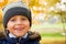 Smiling small boy in autumn